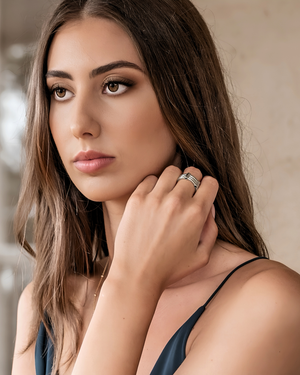 Model wearing CVLCHA silver ADIRA  ring, with a neutral background