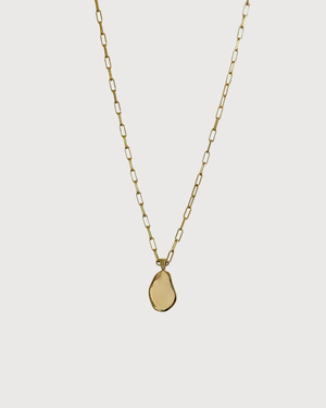 Cvlcha Gold necklace with a geometric pendant on a light gray background