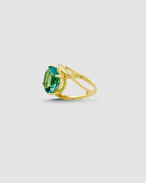 Product shot of The ADRIATIC Ring featuring a light catching aquamarine-coloured round brilliant-cut 5A cubic zirconia set in 14K gold plated .925 sterling silver