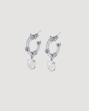 Side view of Arc Hoops showing natural moonstones suspended beneath polished sterling silver hoops.