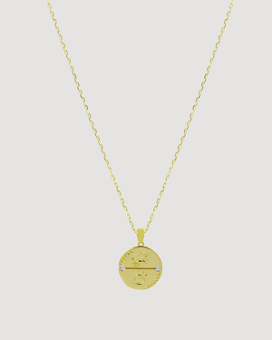 Aries Zodiac Gold Necklace Cvlcha  with a circular pendant on a light gray background