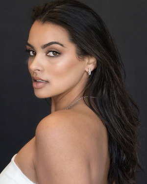 Model wearing CLIO Opal Hoop Earrings by CVLCHA, featuring luminous opal hoops styled for modern everyday elegance.