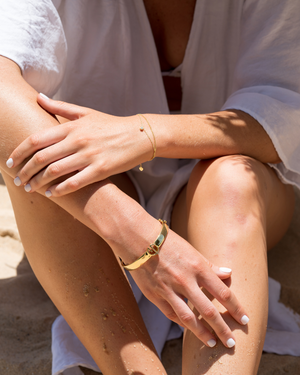 Close up model shot of women wearing the signature CVLCHA designer bangle bracelet styled for effortless everyday luxury.