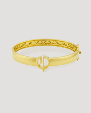 Signature CVLCHA designer gold bangle bracelet in 14k gold plated sterling silver featuring engraved detailing and iconic symbol.