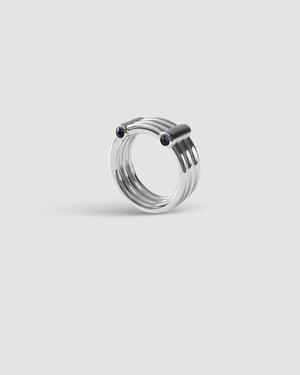 Cvlcha Adira Silver Ring with multi bands and embedded gemstones on a light Gray background