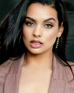 Model wearing the signature CVLCHA Drop Earrings styled with effortless modern elegance for everyday wear.