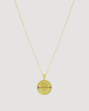 Gemini Zodiac Gold necklace by Cvlcha with a round pendant on a light grey background