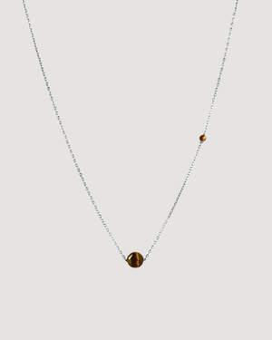 Up close Product shot of the Cvlcha Iris Tiger Eye gemstone Pendant Silver Necklace against a light grey background