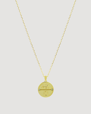 Cvlcha Leo Zodiac Gold necklace with a round pendant on a light gray background