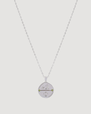 Cvlcha Leo Zodiac Gold Necklace Cvlcha against a light grey background  background