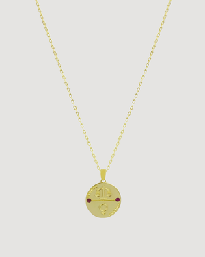 Cvlcha Gold Libra Zodiac necklace with a round pendant on a light gray background