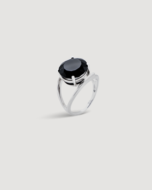 Cvlcha Silver cocktail ring with a striking black brilliant cut 5a cubic zirconia on a light gray background