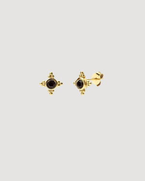 Black Onyx Star Stud Earrings in Gold by CVLCHA featuring a four-point star design with a polished black crystal in sterling silver.