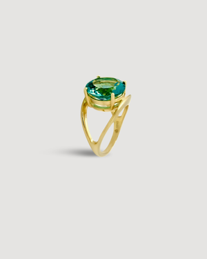 Product shot of The ADRIATIC Ring featuring a light catching aquamarine-coloured round brilliant-cut 5A cubic zirconia set in 14K gold plated .925 sterling silver