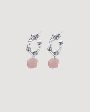 Modern silver hoop earrings featuring natural rose quartz gemstones suspended from textured hoops, designed for everyday wear by CVLCHA.