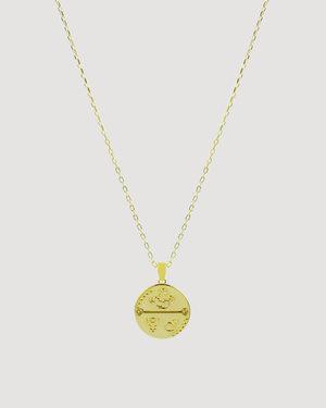 Cvlcha Scorpio Gold necklace with a round pendant on a light gray background