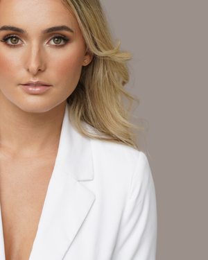 Model wearing the CVLCHA Signature Logo Stud Earrings styled for a modern everyday look with effortless minimalist jewellery.