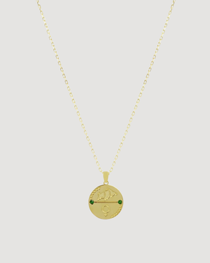 Cvlcha Gold Taurus necklace with a round pendant on a white background