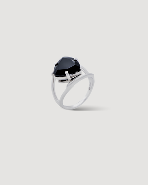 Cvlcha Silver ring with a striking black trillion cut 5a cubic zirconia on a light gray background