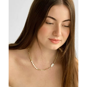 A gold freshwater pearl necklace with a link chain.